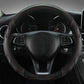 Leather steering wheel cover, black with red contrast stitching on the rim and seams