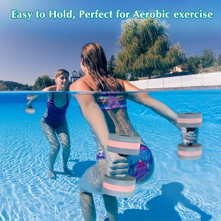 Pink and white floating EVA foam dumbbells with black handles, held in pool