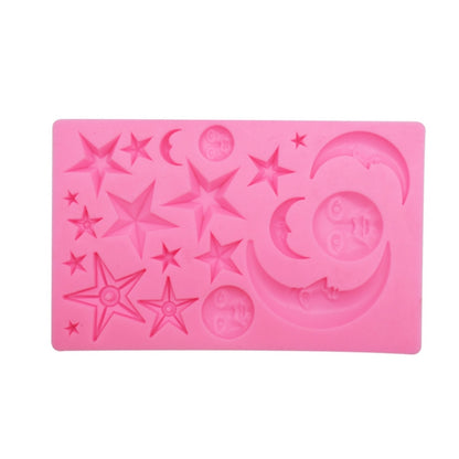 Pink silicone mold with star and crescent moon face relief cavities for chocolate or clay