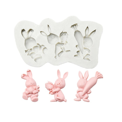 Silicone chocolate mold set with rabbit figures, showing three bunny shapes in cavities