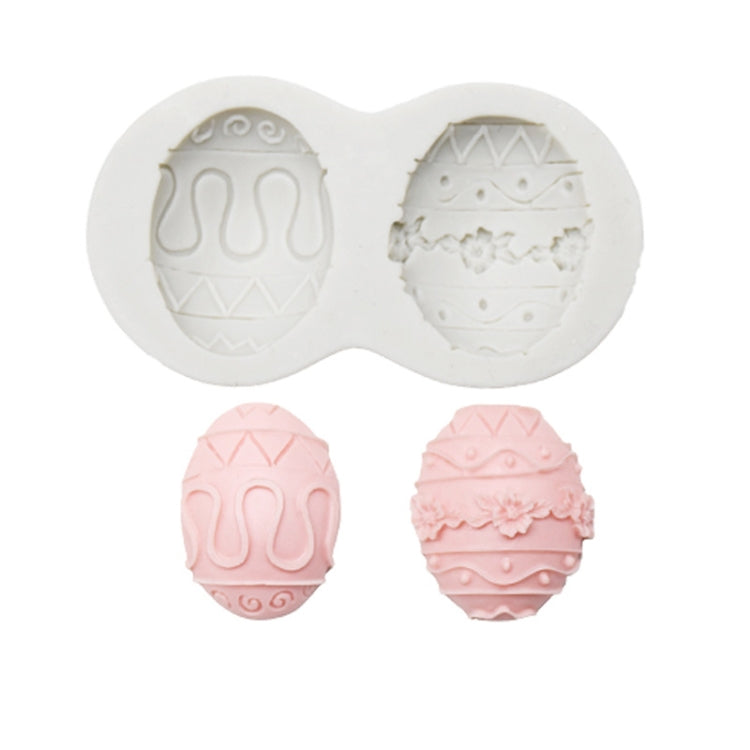 Silicone chocolate mold set with egg designs, showing two egg cavities and pink molded eggs