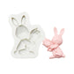 Silicone chocolate mold with sitting bunny relief and molded pink bunny figure