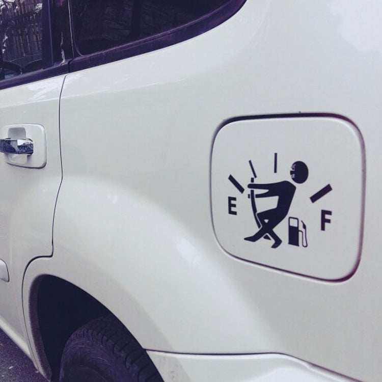 Close-up of white car fuel gauge icon reflective sticker with pump and arrow markings