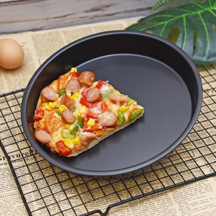 Air fryer baking pan with topped pizza flatbread on a wire rack