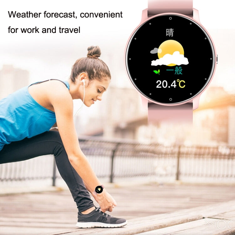 Pink smartwatch on wrist with round black display