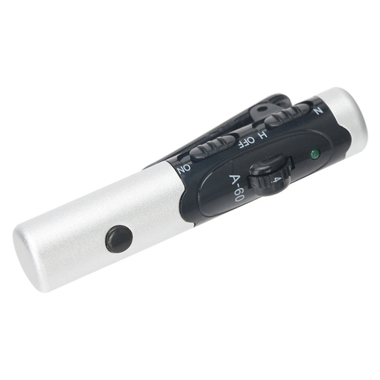 Silver and black hearing aid amplifier with tone buttons and small green light