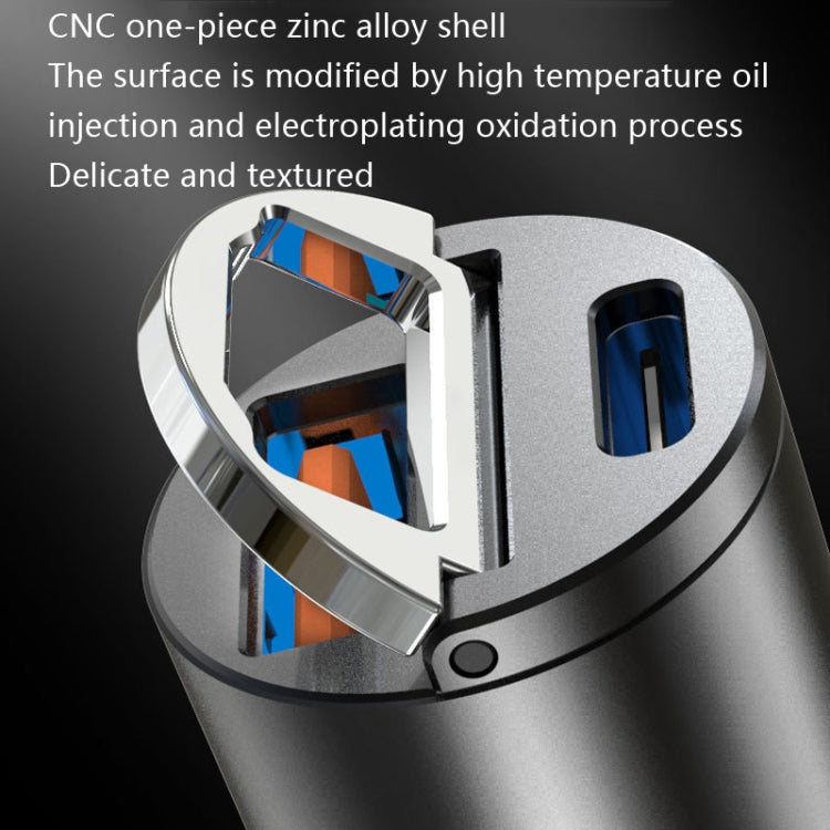 Car cigarette lighter fast charge plug close-up, textured silver shell and dual ports