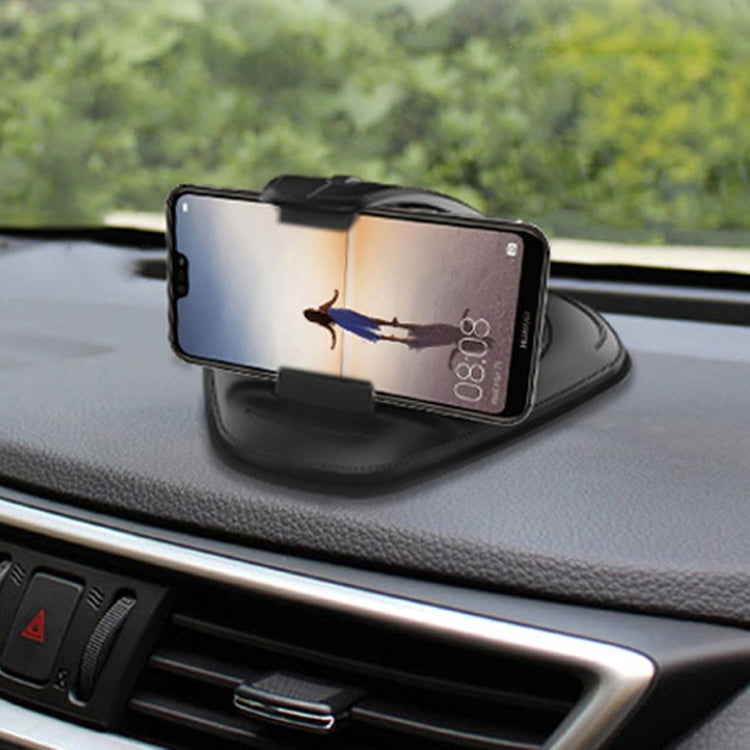Black suction cup phone holder mounted on car dashboard holding a smartphone