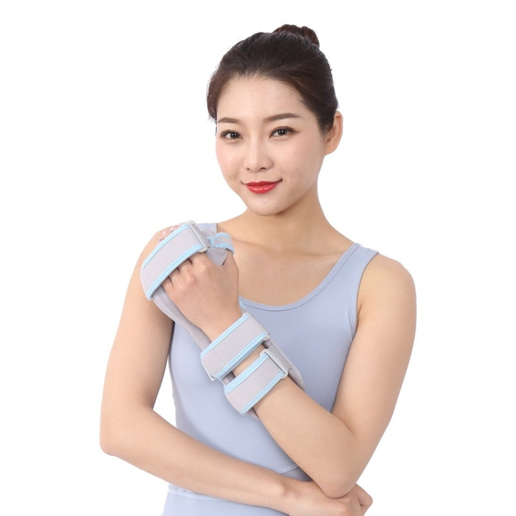 Wrist splint with grey support bar and light-blue straps, secured around the wrist