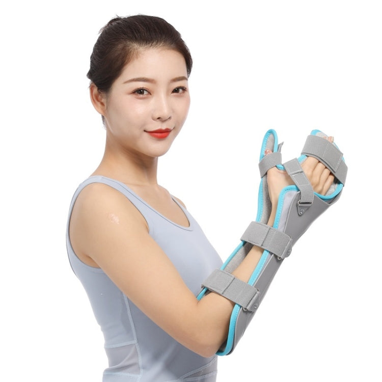 Wrist support splint with grey shell and light-blue elastic straps, worn on arm