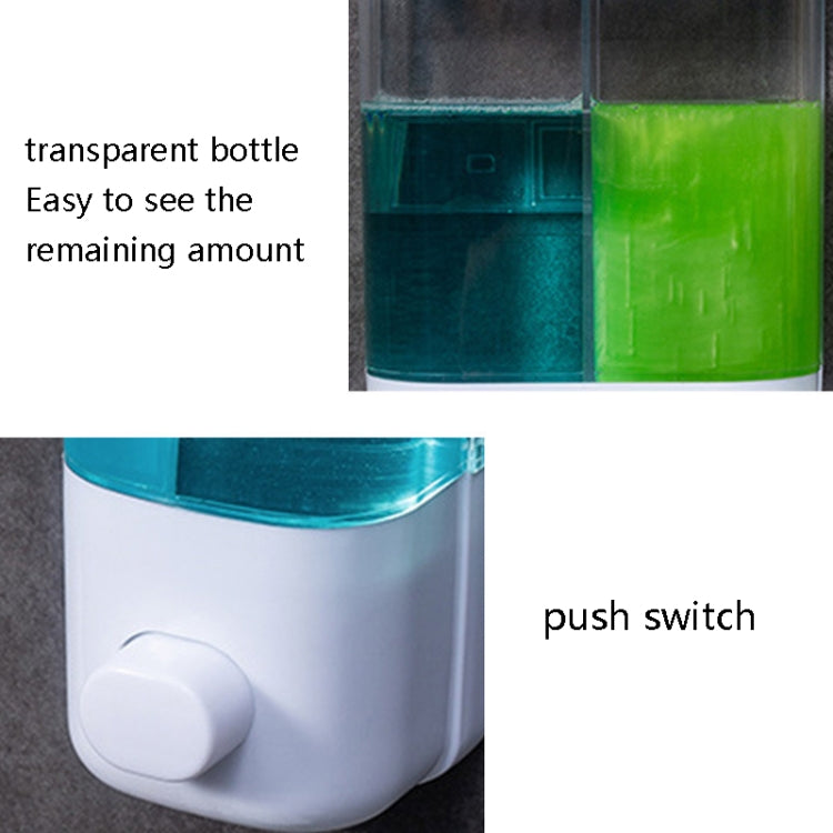 Wall-mounted manual soap dispenser close-up, transparent bottle and front push switch