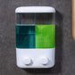 Wall-mounted manual soap dispenser with two push buttons and clear twin compartments