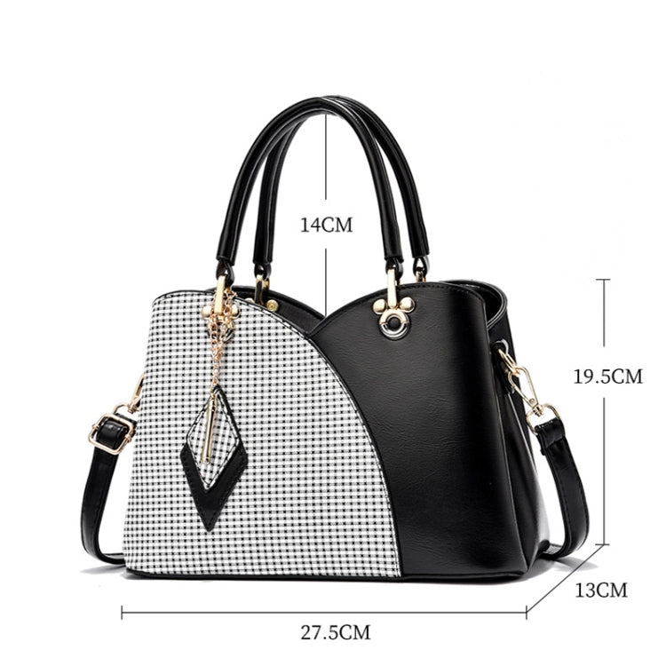Large two-tone handbag with white check lattice front and black leather-look side, top handles