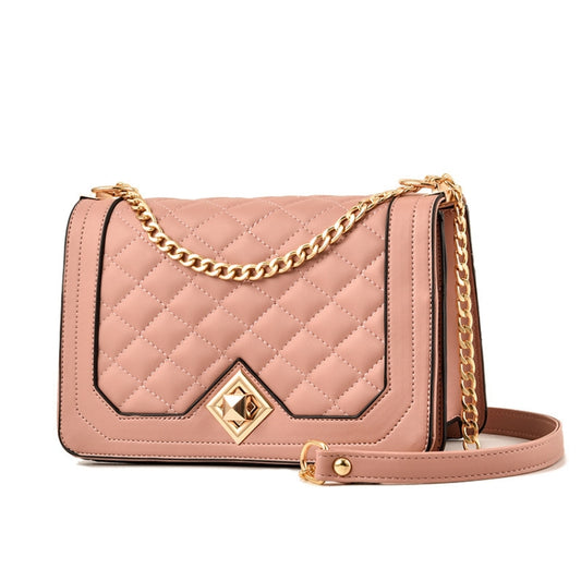 Pink quilted one-shoulder flap bag with gold chain and diamond logo emblem.