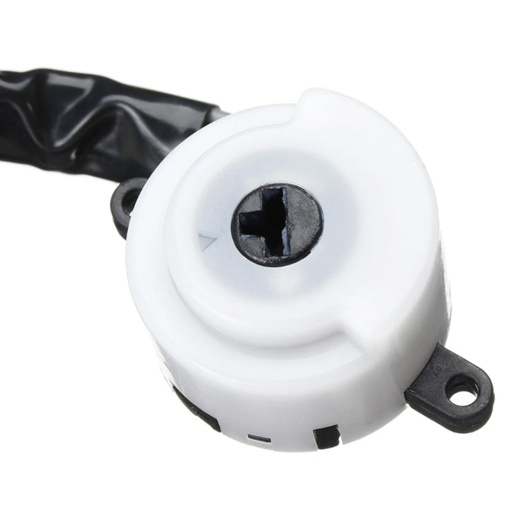 White ignition switch housing with black screw terminal and mounting tab