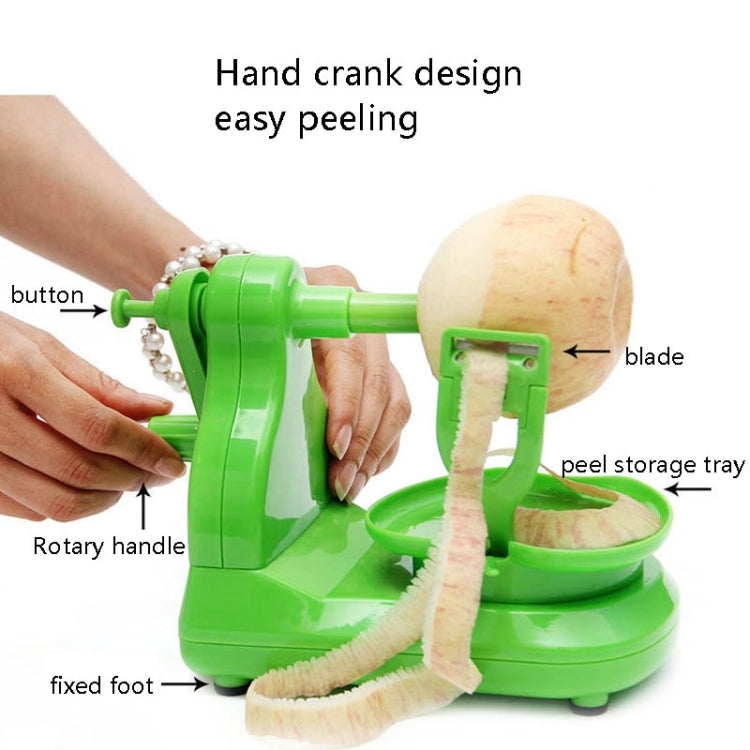Green fruit peeler dispensing peel strips from the blade onto the base tray