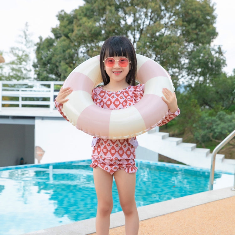 Inflatable underarm swimming ring with pink-and-white stripes, held around chest