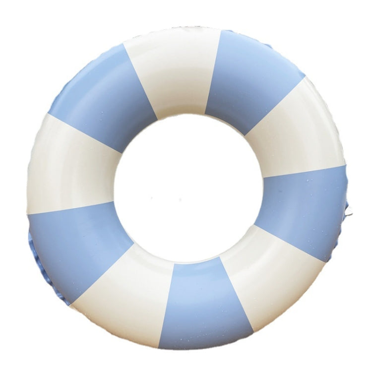 Close-up of inflatable underarm swim ring with white and blue stripe panels