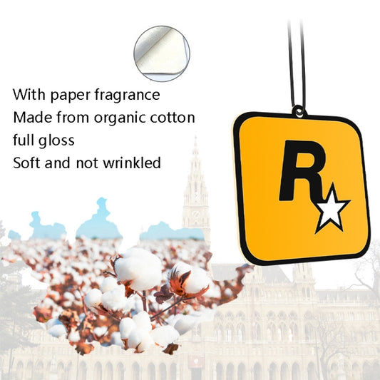 Orange R star car fragrance tag hanging from a cord