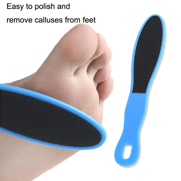 Blue-handled black emery foot file smoothing a bare foot sole