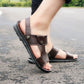 Men's brown leather-look slide sandals with ankle strap and circular buckle detail