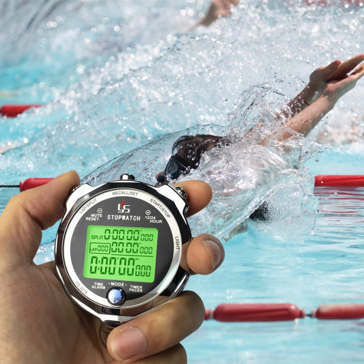 Metal luminous stopwatch held poolside, displaying green LCD timer during swim
