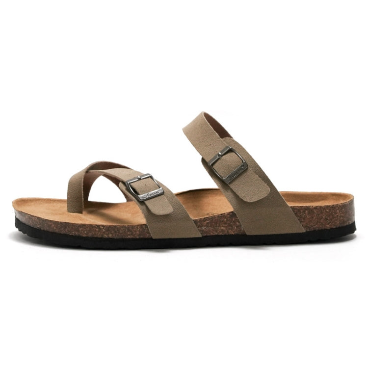 Brown cork slide sandals with adjustable straps and flat sole, front view of pair.