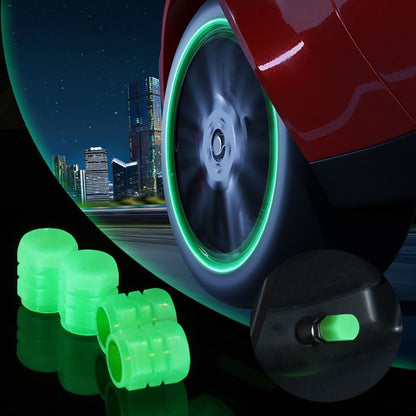 Luminous green split-effect tire valve caps, set of 4, glowing on valve stems