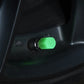 Green luminous tire valve cap fitted on a motorcycle wheel valve stem
