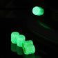 Luminous green split-effect tire valve caps glowing in the dark, set of 4