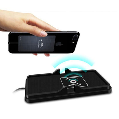 Black wireless car phone charging pad with anti-slip launch base and phone in place