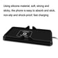 Black anti-slip wireless charging pad with center charging coil icon