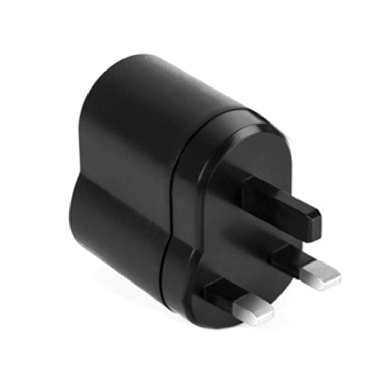 Black two-prong plug adapter for car power, compact cylindrical body