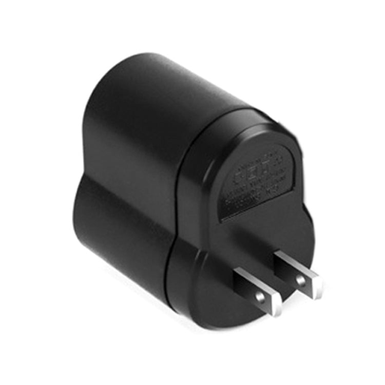 Black two-prong plug adapter with recessed label panel, compact cylindrical body