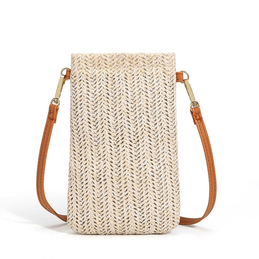 Beige straw one-shoulder phone bag with tan leather straps and metal snap