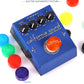 Set of colored guitar tuner pedal caps: yellow, red, purple, green, orange, blue, black