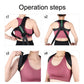 Black open-shoulder posture belt worn on the upper back with green chevron panel