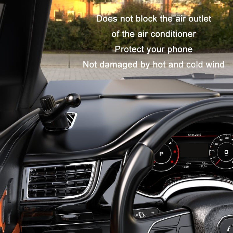 Black phone bracket mounted on car dashboard near vents, metal hook arm