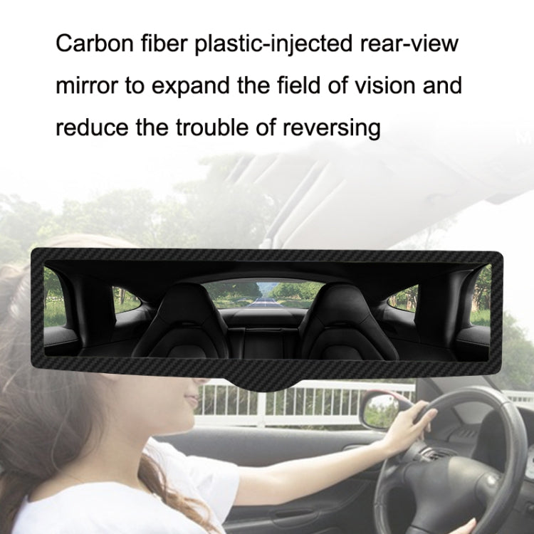 Car interior auxiliary rearview mirror mounted on windshield area, long rectangular
