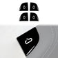 Four black window switch sticker pieces with white button-arrow icons