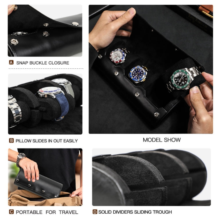 Black leather watch storage box detail: snap buckle closure and sliding divider tray