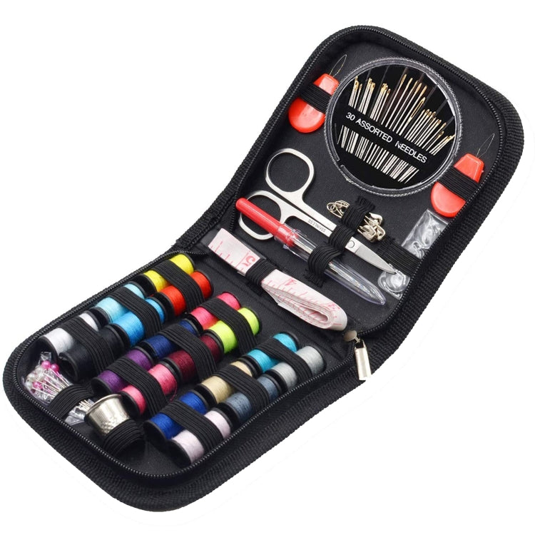 Black fabric sewing kit pouch with colorful thread spools, needles, scissors, and pins