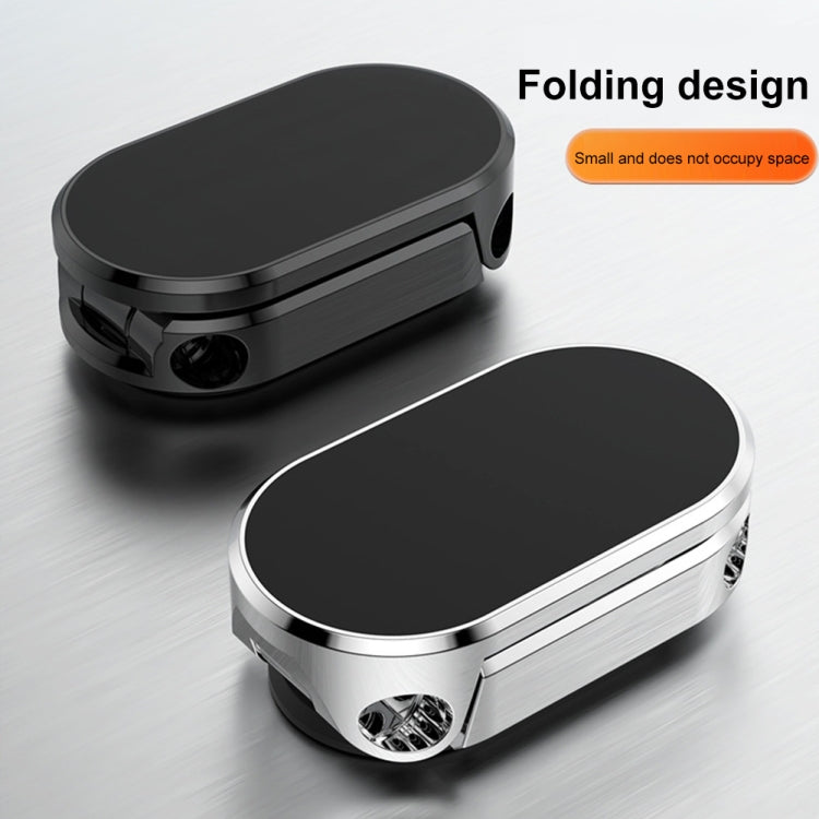 Foldable magnetic navigation bracket with black oval pad and silver frame