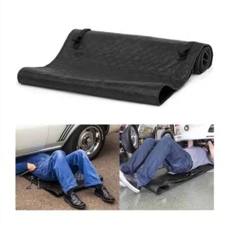 Black reclining car repair pad with rolled edge and textured surface