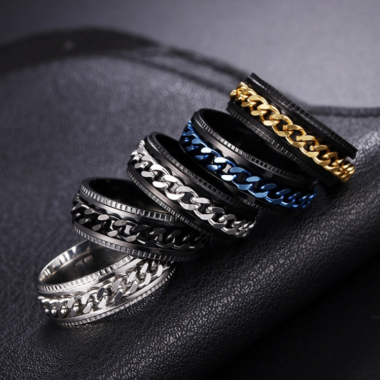 Pair of turnable chain rings, black and silver embossed bands, on leather display