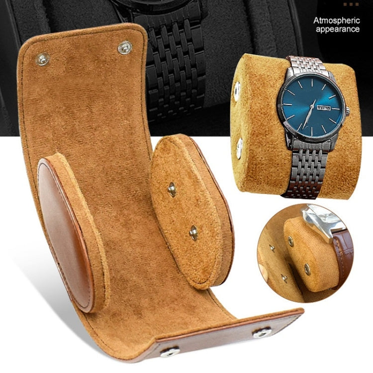 Brown PU leather 1-slot watch case with snap hardware and removable inner cushion.