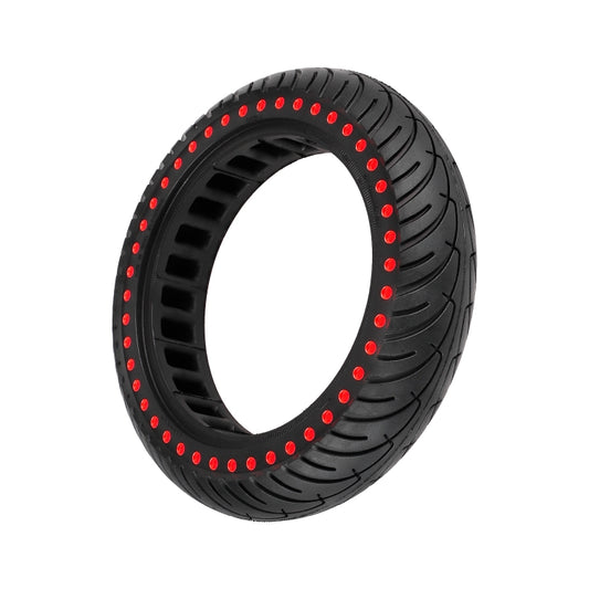 Black scooter tire with red dot rim edge and honeycomb tread pattern