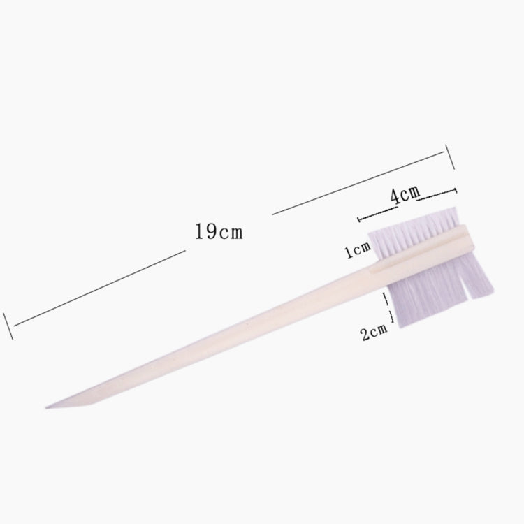 White double-sided groove cleaning brush with stiff bristles and pointed handle