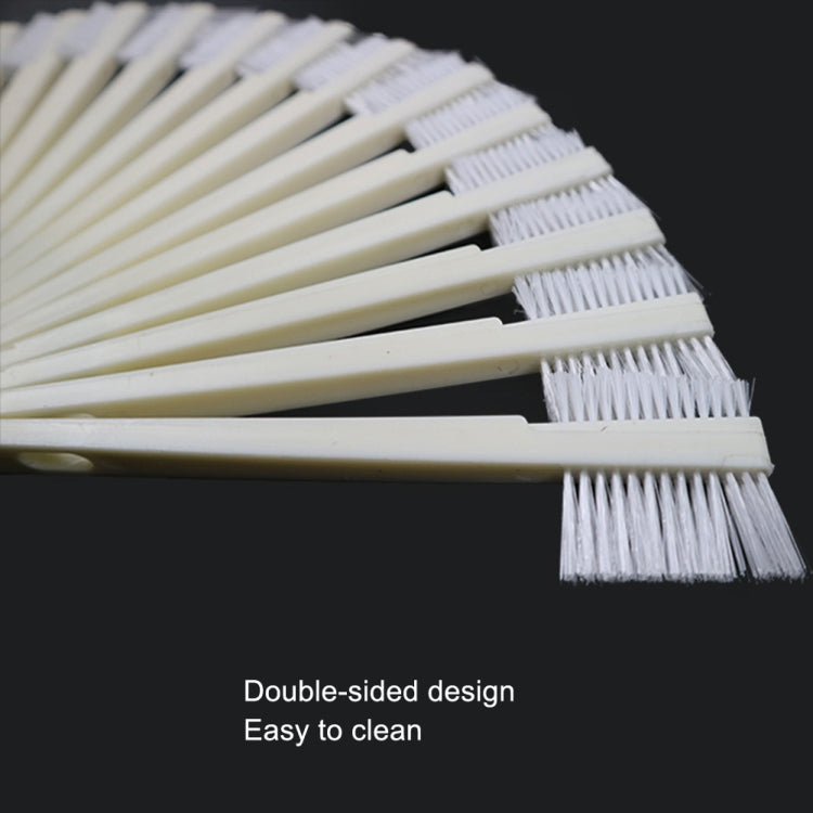 Close-up of white double-sided groove brushes with stiff, dense bristles