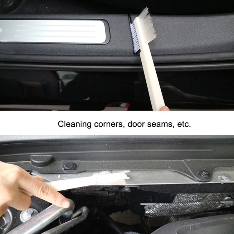White small bristle cleaning brush for corners and door seams in car interiors